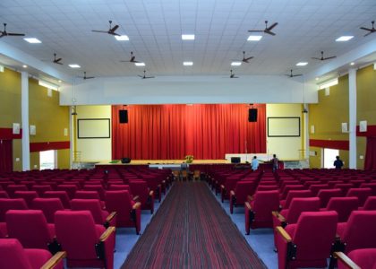 Building a permanent multipurpose auditorium in the local government school.